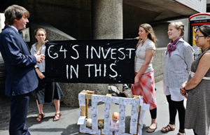 Photo of students confronting Nick Buckles at a demonstration